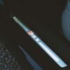 Detailed view of Audi RS3 door sill featuring illuminated logo, captured in moody lighting.