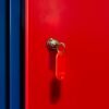 A vibrant image of a red locker door with a key in the lock, featuring bold primary colors.