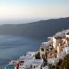 Stunning whitewashed architecture and sea view from Imerovigli, Santorini during sunset.