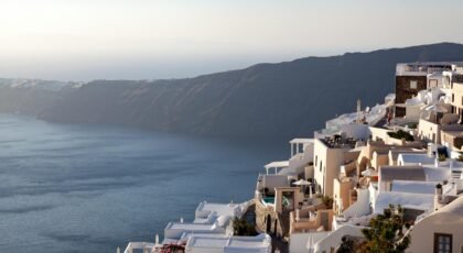 Stunning whitewashed architecture and sea view from Imerovigli, Santorini during sunset.