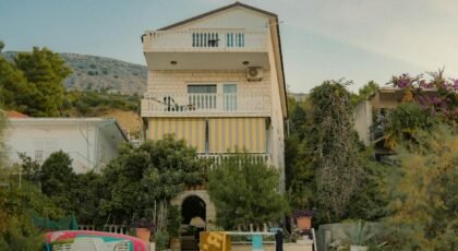 A quaint villa nestled in the natural beauty of Split, Croatia, offering serene accommodation with lush surroundings.