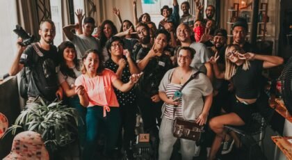 Diverse group enjoying a cheerful meeting indoors in São Paulo, capturing unity and joy.