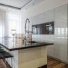 Stylish modern kitchen with an island and sleek cabinetry, perfect for contemporary living.