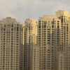 A close-up view of modern high-rise buildings in Dubai Marina, showcasing architectural detail and luxury living.