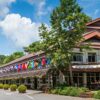 Doi Tung Palace adorned with international flags, nestled in Chiang Rai, Thailand.
