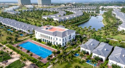 A stunning aerial shot of a luxurious tropical resort with villas and a pool in Vietnam.