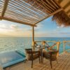 Enjoy a peaceful sunrise view from an oceanfront villa in the Maldives, offering tranquility and beauty.
