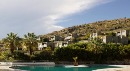 Overlooking a serene pool and lush landscape in Bodrum, Türkiye, perfect summer getaway.
