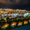 Captivating night view of a luxury hotel and surrounding villas in Tenerife, Spain.